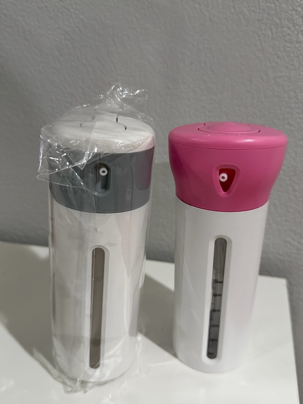 4-in-1 travel dispenser bottles Gray And Pink